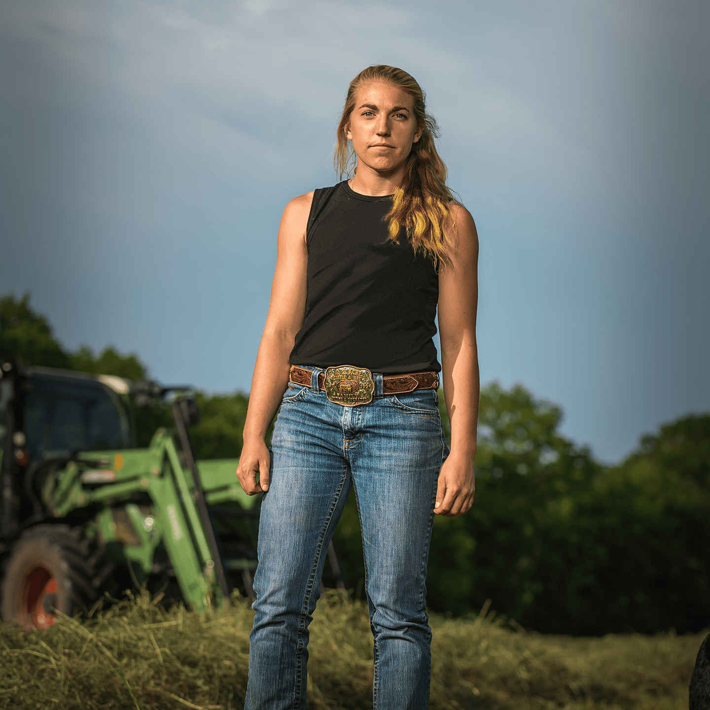 woman standing in a pasture