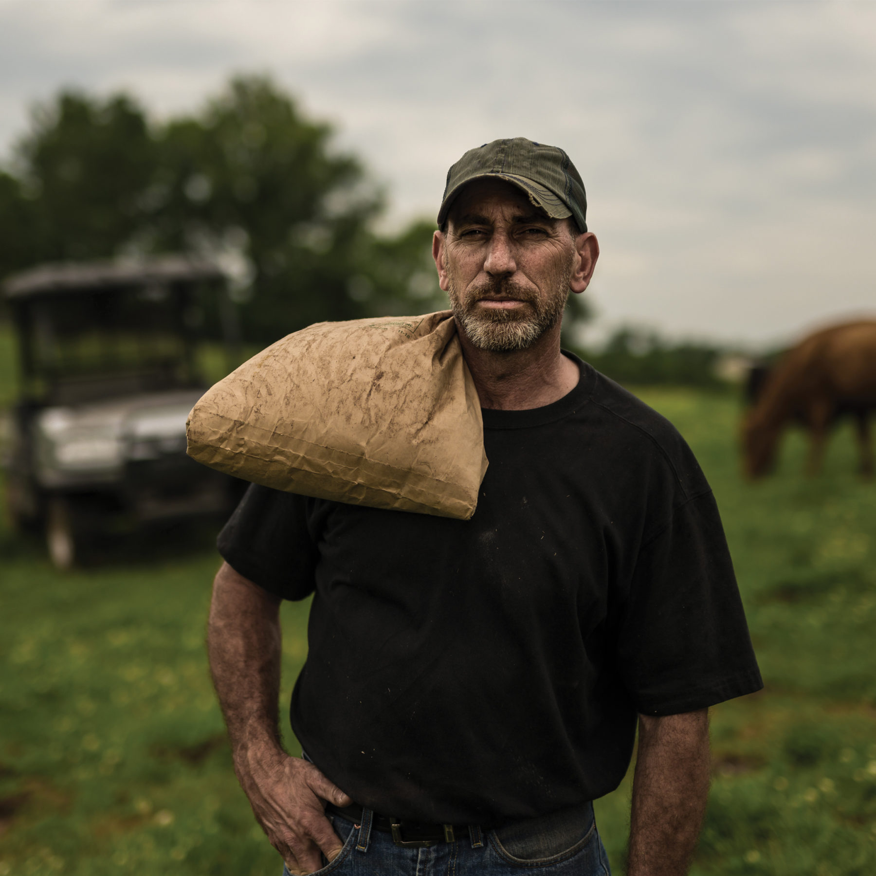 man carrying bag of grain