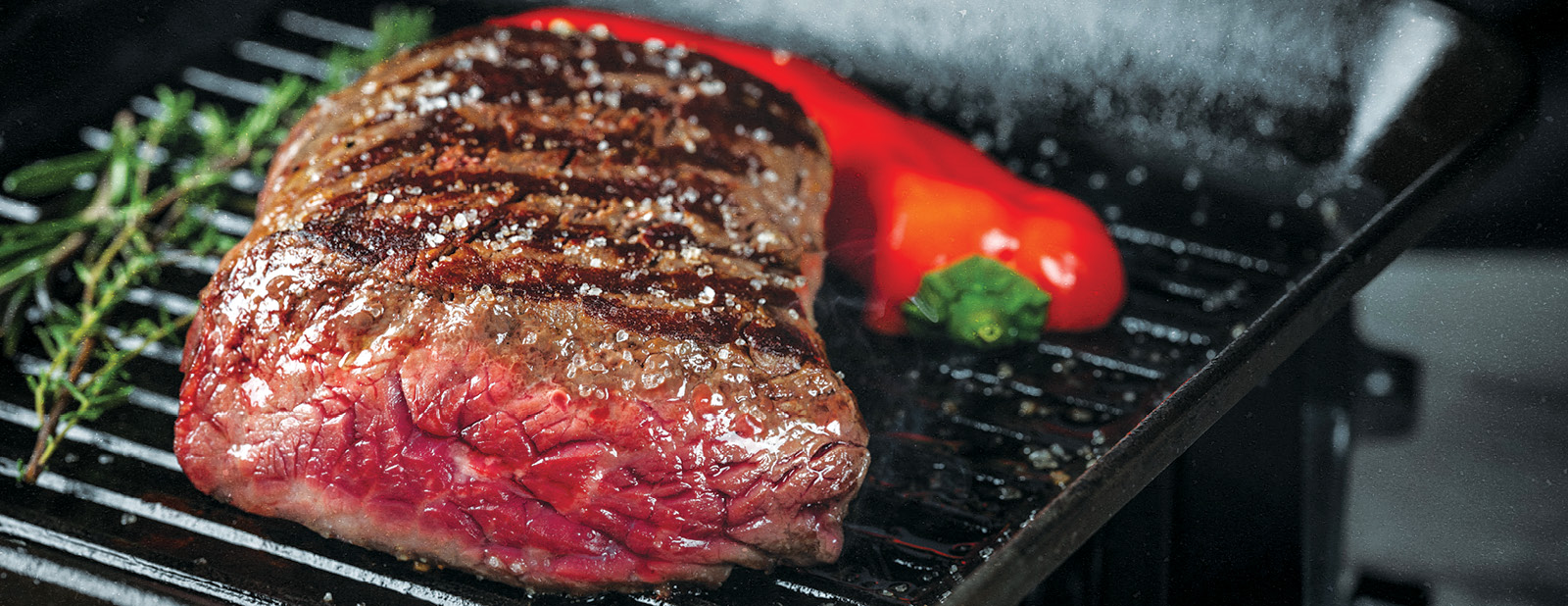 close up of a steak on a grill
